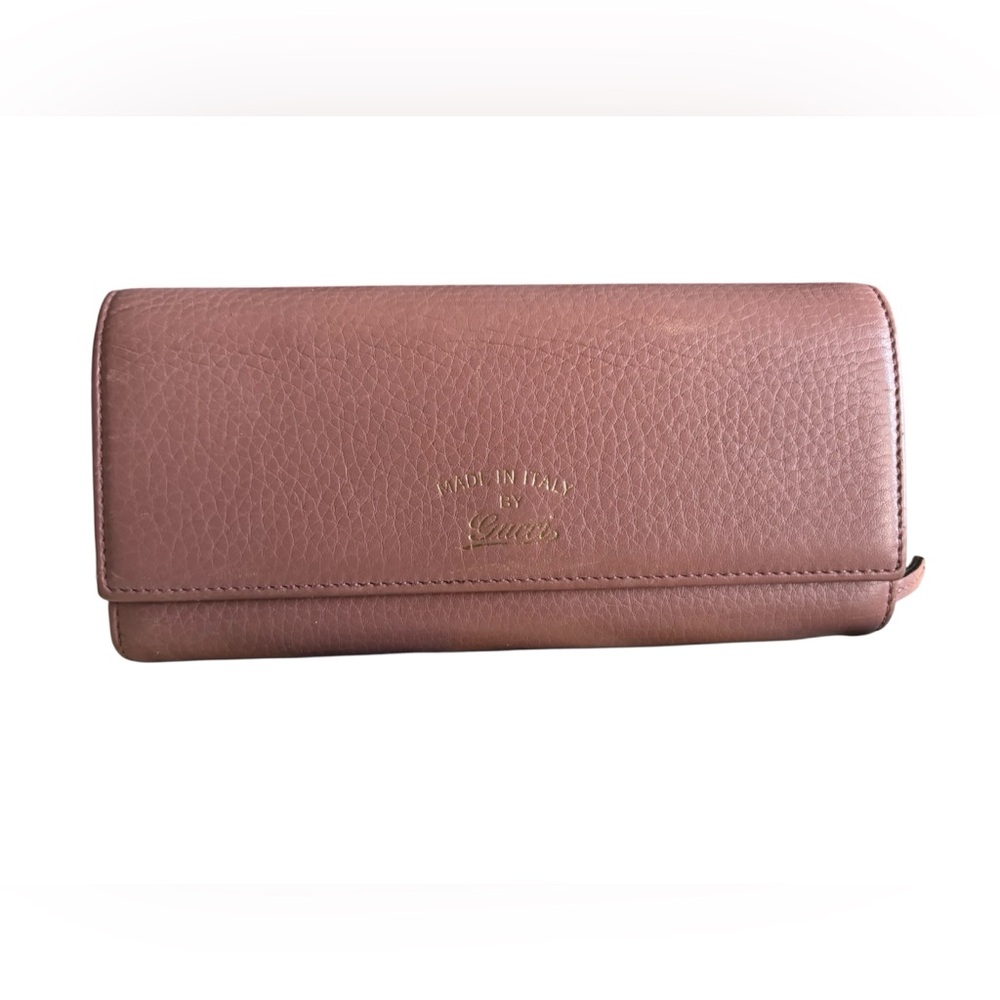 Gucci Floral tan leather wallet with floral interior  in EUC.